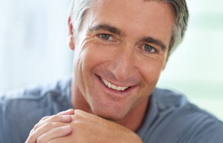 That smile has melted man a heart. Portrait of a handsome mature